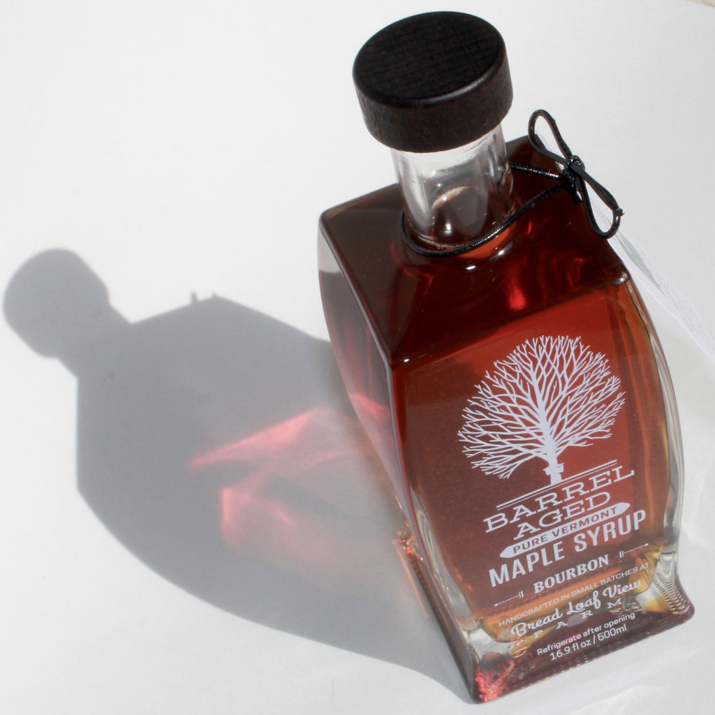 Vermont Bread loaf farm barrel aged pure maple syrup bourbon flavored in 16.9 fl oz bottle overhead view