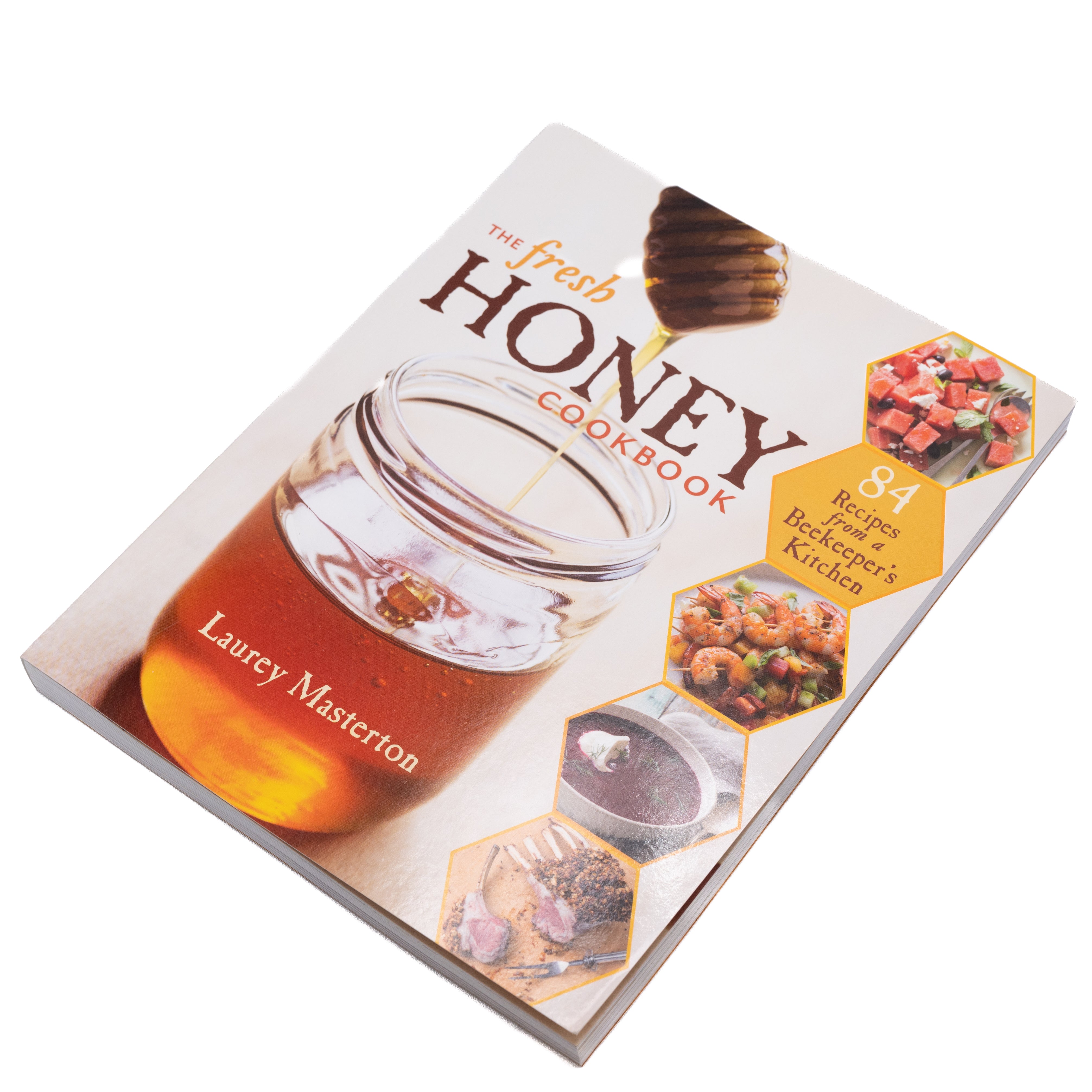 Front cover of the fresh honey cookbook by Laurey Masterton featuring a large jar of liquid honey