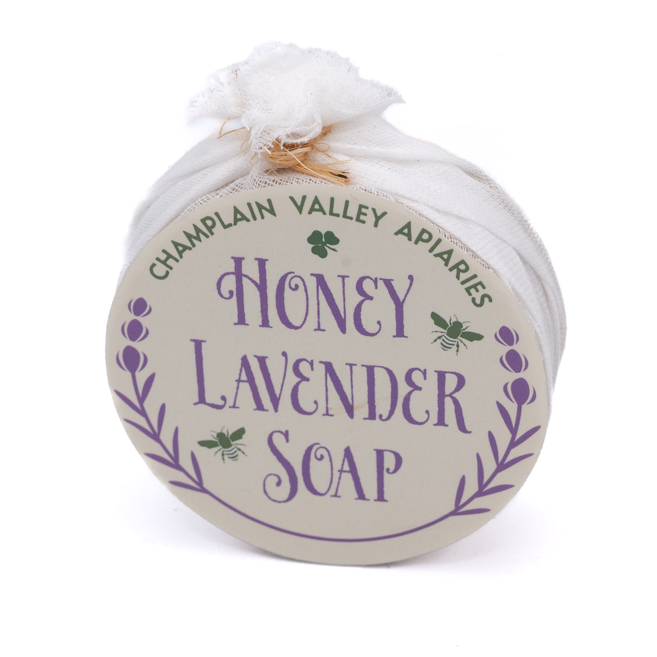 Round bar of honey lavender soap wrapped in cheesecloth 
