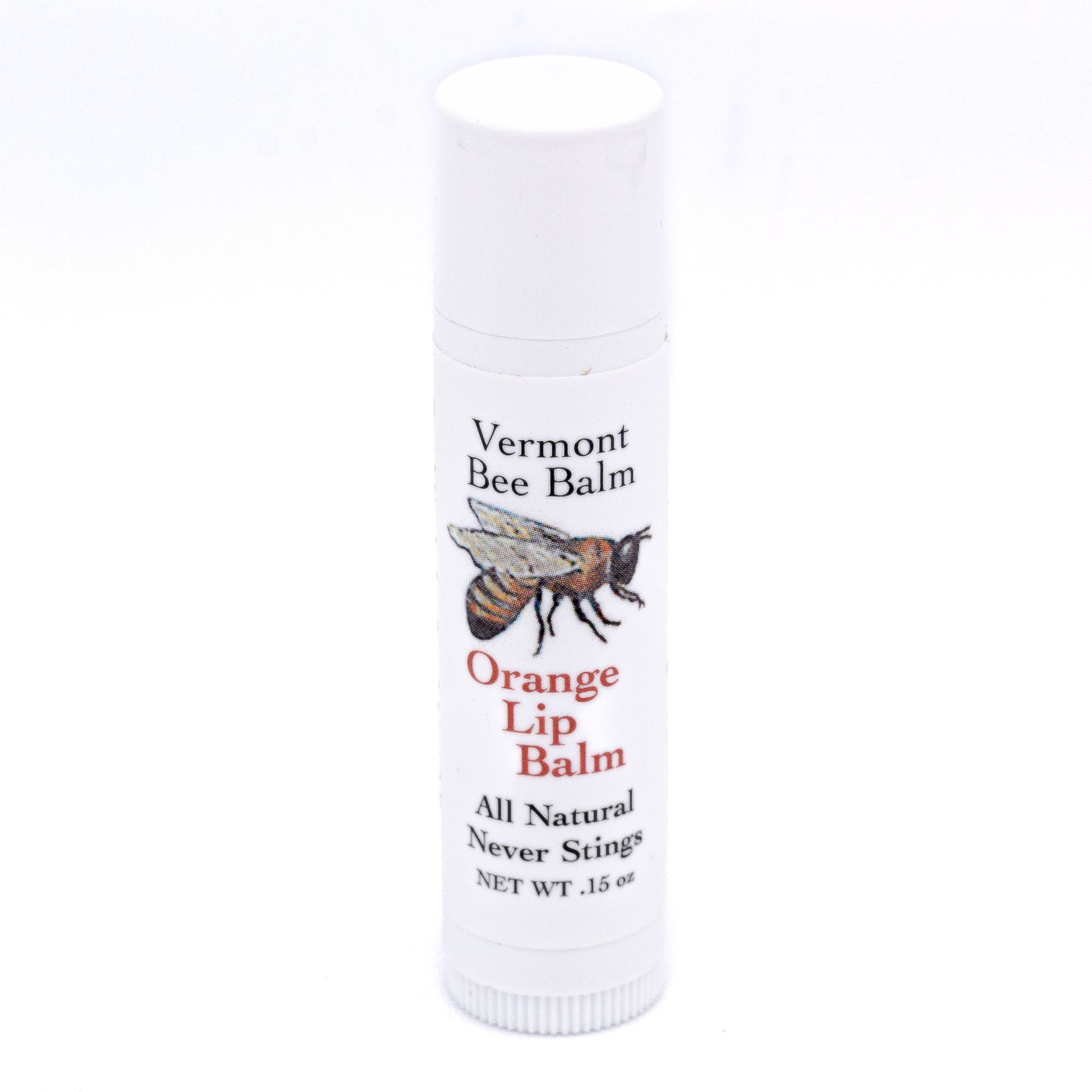 vermont bee balm tube of orange lip balm white with bee logo